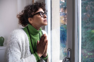 Black woman at home feeling sad and depressed