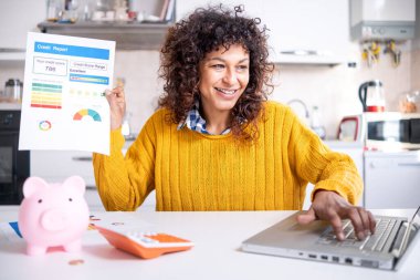 Cheerful black woman holding good credit score bank statement