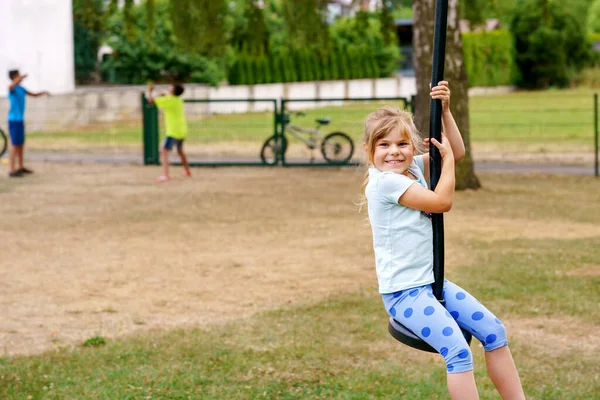 Happy Kid Girl Rids Zip Line Swing Outdoor Game Play — Zdjęcie stockowe