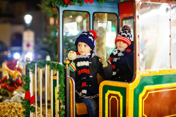 Two Little Kids Boys Carousel Christmas Funfair Market Outdoors Happy — Stock Photo, Image