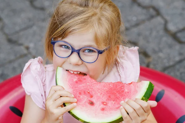 Cute Little Girl Glasses Eating Watermelon Inflatable Ring Summertime Happy — Zdjęcie stockowe