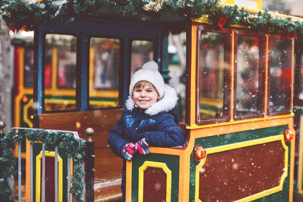 Little Preschool Girl Carousel Train Christmas Funfair Market Outdoors Happy — Stock Photo, Image
