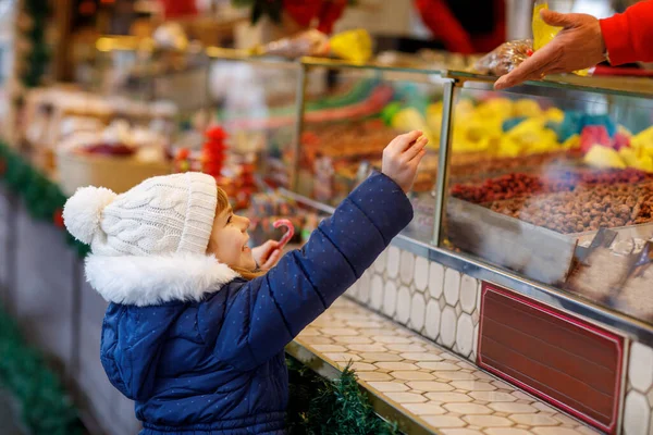 Little Cute Preschool Girl Buying Candy Cane Sweets Stand Christmas — Stock Photo, Image