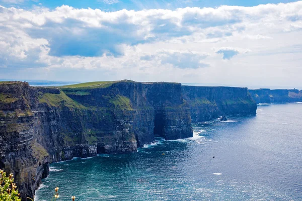 stock image Spectacular Cliffs of Moher are sea cliffs located at the southwestern edge of the Burren region in County Clare, Ireland. Wild Atlantic way.