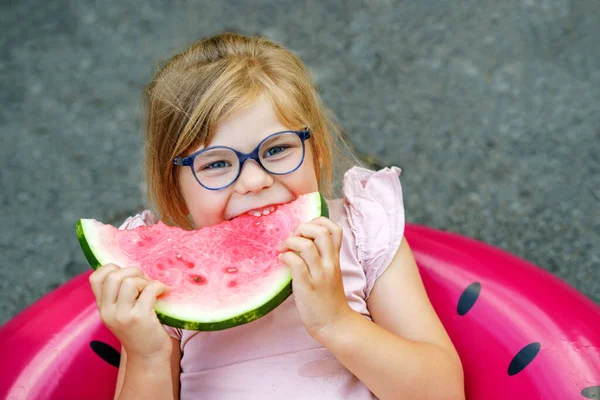 Cute Little Girl Glasses Eating Watermelon Inflatable Ring Summertime Happy — Zdjęcie stockowe