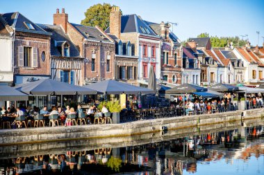 AMIENS, FRANCE - August 20, 2022: Restaurants in the old town of Amiens, France by sunset. clipart