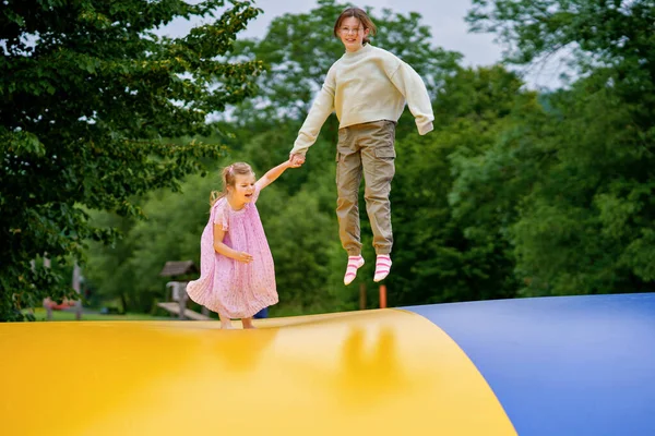 Little Preschool Girl School Sister Jumping Trampoline Happy Funny Children — Stock Photo, Image