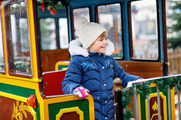 Little Preschool Girl Carousel Train Christmas Funfair Market Outdoors Happy — Stock Photo, Image