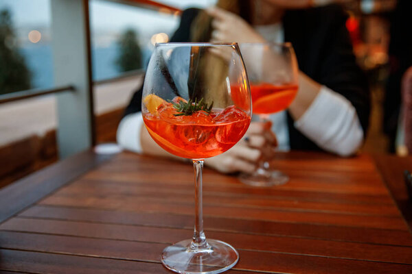 two aperol spritz on a summer evening in a mediterranean restaurant