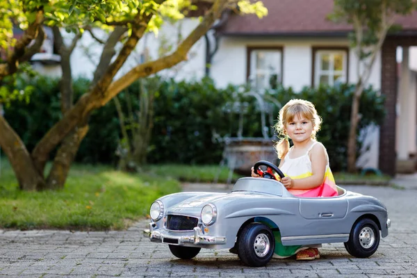 Little Adorable Toddler Girl Driving Big Vintage Toy Car Having — Stock Photo, Image