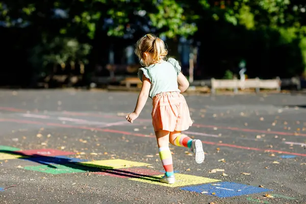 Cute Little Toddler Girl Playing Hopscotch Game Drawn Colorful Chalks — Stock Photo, Image