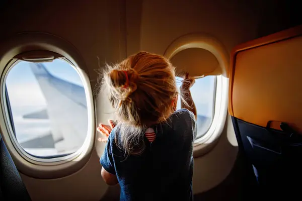 Adorable Little Girl Traveling Airplane Child Sitting Aircraft Window Looking — Stock Photo, Image