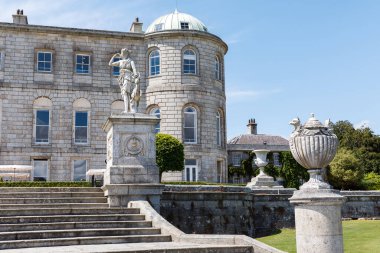 Powerscourt House at Powerscourt Garden. Panoramic view. Its one of leading tourism attractions in Enniskerry, Ireland. clipart