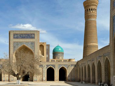 Bukhara, Uzbekistan Aerial view of Kalan Minaret Emir and Alim Khan madrasah of Po-i-Kalan - islamic religious complex. clipart