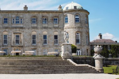 Powerscourt House at Powerscourt Garden. Panoramic view. Its one of leading tourism attractions in Enniskerry, Ireland. clipart