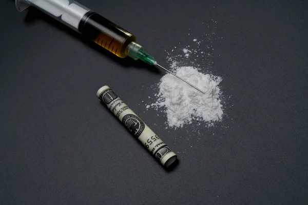 stock image Cocaine or other illegal drugs, white powder, syringe, isolated on black glossy background