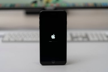 Apple iPhone updated iOs, apple icon and status bar on screen, selective focus clipart