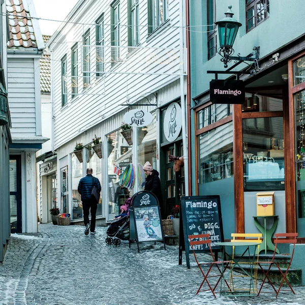 stock image Stavanger, Norway, March 10 2023, People Walking Around Traditional Historic Old Town Stavanger Shopping Or Sightseeing