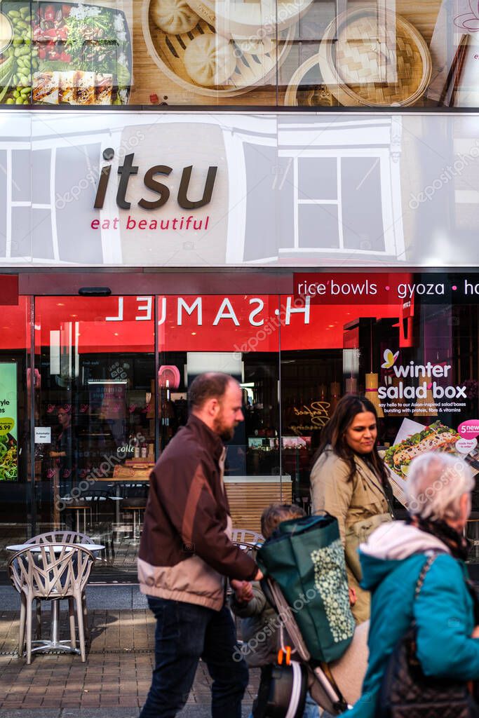 Kingston-Upon-Thames, London UK, February 12 2024, People Walking Past A High Street Branch Of Itsu Asian Food Restaurant
