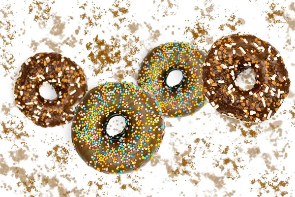 Flying falling levitating floating brown sweet sugar glazed doughnuts,tasty donuts in air on white spotted painted abstract background.Creative dessert food.Trendy,healthy unhealthy nutrition,mockup