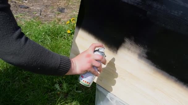 Mans Male Hand Painting Wood Black Spray Paint Worker Applying — стоковое видео