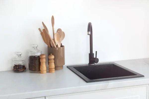 minimalism in the kitchen, black sink and faucet , winter holidays
