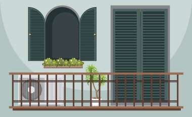 Bitkilerle ve pencerelerle dolu bir balkon.