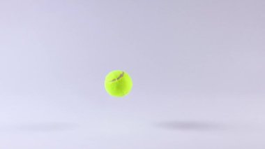 Bir tenis topu düz bir zeminde zıplar.