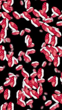 Tuna nigiri parçaları siyah bir arkaplanda dalgalanarak dinamik ve canlı bir görsel deneyim yaratıyor.