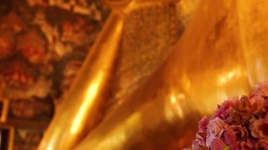 Golden Buddha statue in Bangkok temple setting