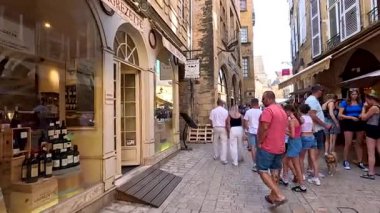People walking and shopping in a quaint street