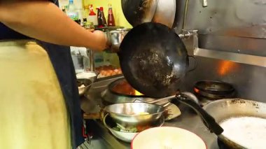 Chef preparing dishes in a bustling kitchen