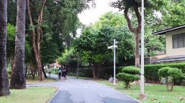 People walking along a garden path