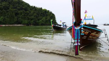 Boat approaching shore in Krabi, Thailand