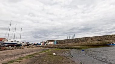Boats arriving at a dock in Fife