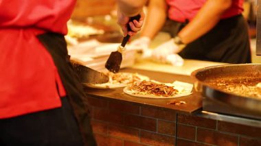 Chef cooking kebab meat at Phuket street food market stall