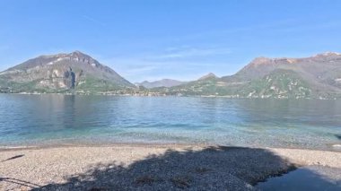 Waves gently lap the shore in Varenna
