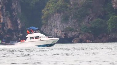 Speedboat cruising past Krabi's scenic cliffs