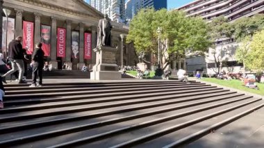 People enjoying the library's outdoor area