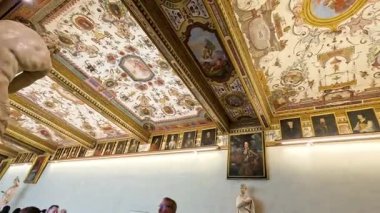 Ornate ceiling with paintings and sculptures