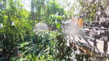 Visitors enjoy waterfall at Chonburi zoo