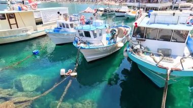 Boats docked in clear turquoise water