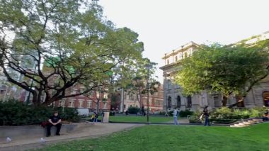 People enjoying the library's outdoor area