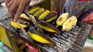 Bananas being grilled at a floating market