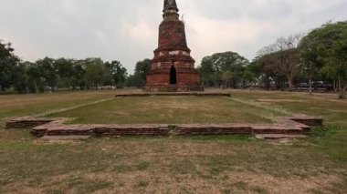 Historic structures amidst tranquil greenery and clear skies