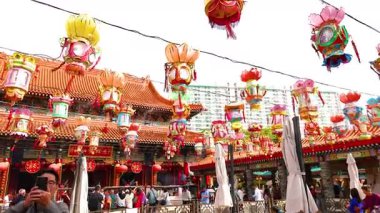 Colorful lanterns hanging at a bustling temple