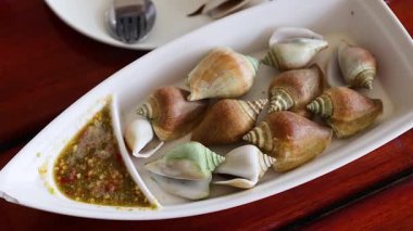 Seafood shells with spicy dipping sauce