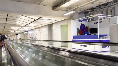 Passengers on a moving walkway at Suvarnabhumi Airport