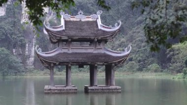 Static view of an Asian-style pagoda over water