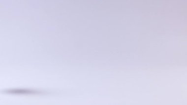 A blue tennis ball bounces repeatedly